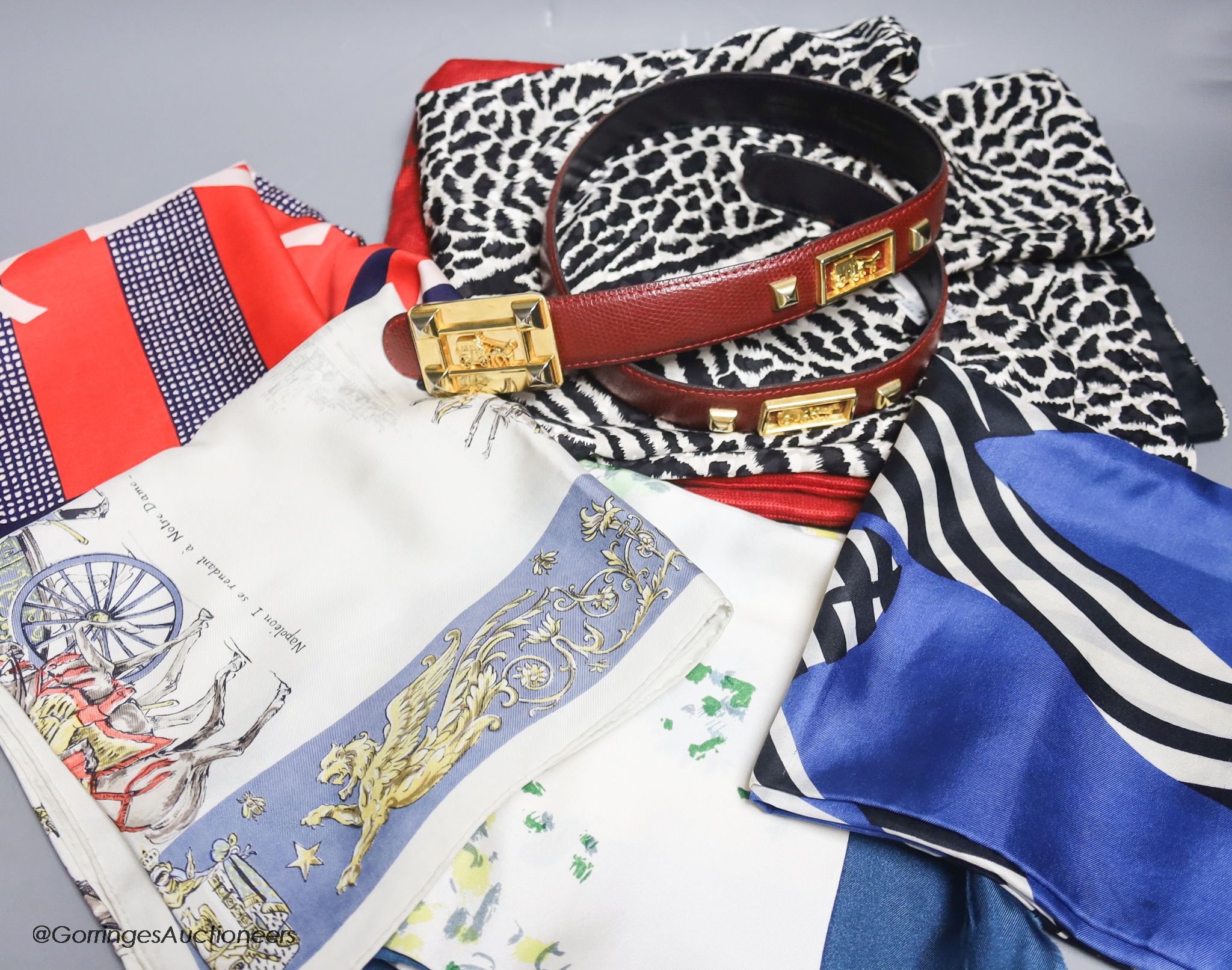 An Yves Saint Laurent black and white animal print silk top, a Laure de France leather belt and four vintage designer silk scarves